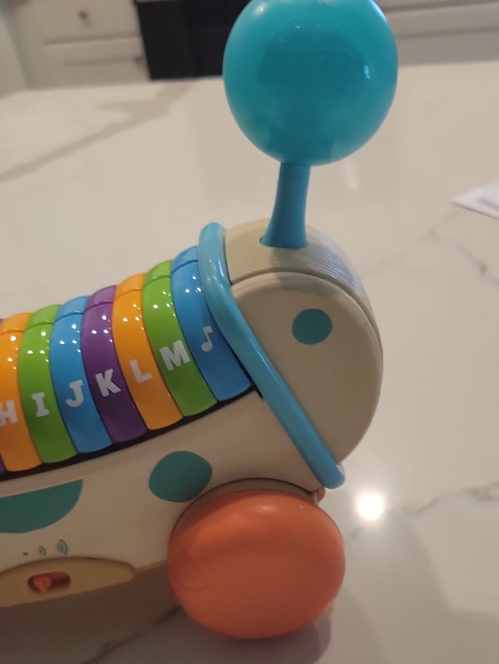 Leapfrpg Pull-Along Dog Xylophone Toy in Blue, Orange, Green